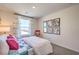 Bedroom with large window, comfy bed, and wall art at 10168 Mulberry Ridge St # 43, Las Vegas, NV 89141