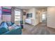 Spacious loft with teal couch, media console and window seat at 10168 Mulberry Ridge St # 43, Las Vegas, NV 89141