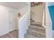 Modern staircase with gray carpeting and white walls at 10168 Mulberry Ridge St # 43, Las Vegas, NV 89141