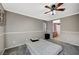 Bedroom with gray carpet, ceiling fan and en-suite bathroom at 10191 Cougar Crossing St, Las Vegas, NV 89178