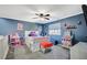 Upstairs bedroom with ceiling fan and plush carpeting at 10191 Cougar Crossing St, Las Vegas, NV 89178