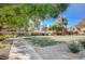 Landscaped community green space with walking path at 10191 Cougar Crossing St, Las Vegas, NV 89178