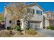 Two-story house with attached garage and landscaping at 10191 Cougar Crossing St, Las Vegas, NV 89178