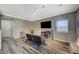 Living room features wood-look floors and a modern fireplace at 10191 Cougar Crossing St, Las Vegas, NV 89178