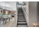 Staircase leading to upper level with kitchen view at 10191 Cougar Crossing St, Las Vegas, NV 89178