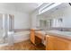 Bathroom features a shower, bathtub and double vanity at 10441 Concetta Ave, Las Vegas, NV 89129