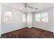 Upstairs bedroom with carpet and multiple windows at 10441 Concetta Ave, Las Vegas, NV 89129