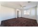 Upstairs bedroom with carpet, ceiling fan and window at 10441 Concetta Ave, Las Vegas, NV 89129