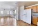 Kitchen with light wood cabinets, white appliances, and tile floor at 10441 Concetta Ave, Las Vegas, NV 89129