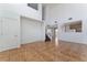 High ceiling living room with tile floors and a staircase at 10441 Concetta Ave, Las Vegas, NV 89129