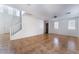 Living room with high ceilings, tile floor, and staircase at 10441 Concetta Ave, Las Vegas, NV 89129