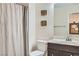 Simple bathroom with a shower/tub combo and vanity at 10548 Seasonable Dr, Las Vegas, NV 89129