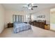 Bright bedroom with carpeted floors, a dresser, and a bed at 10548 Seasonable Dr, Las Vegas, NV 89129