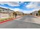 Gated community entrance with attractive landscaping and signage at 10691 Sariah Skye Ave, Las Vegas, NV 89166