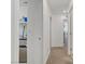 Bright hallway with laundry closet and access to bedrooms at 10691 Sariah Skye Ave, Las Vegas, NV 89166