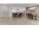 Open concept kitchen and dining area with light wood floors at 10691 Sariah Skye Ave, Las Vegas, NV 89166