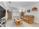 Cozy living room featuring a brown leather couch and coffee table at 10691 Sariah Skye Ave, Las Vegas, NV 89166