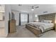 Large bedroom with king-size bed and ceiling fan at 10691 Sariah Skye Ave, Las Vegas, NV 89166