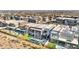 Community aerial view showcasing many modern homes with backyard pools and solar panels at 10896 Tranquil Hills Way, Las Vegas, NV 89135