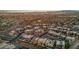 Aerial view of numerous modern homes with pools and a mountainous background at 10896 Tranquil Hills Way, Las Vegas, NV 89135