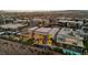 Aerial view of modern homes in a luxury community with pools and mountain views at 10896 Tranquil Hills Way, Las Vegas, NV 89135