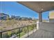 Modern balcony with sleek railings overlooking landscaped desert scenery and contemporary neighborhood homes at 10896 Tranquil Hills Way, Las Vegas, NV 89135