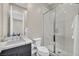 Clean bathroom with a shower, toilet, and modern vanity at 10896 Tranquil Hills Way, Las Vegas, NV 89135