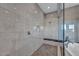 Spa-like bathroom with a large shower, soaking tub, and pebble floor at 10896 Tranquil Hills Way, Las Vegas, NV 89135