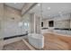 Luxurious bathroom showcasing a freestanding tub, glass shower, and modern vanity with ample counter space at 10896 Tranquil Hills Way, Las Vegas, NV 89135