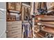 Organized walk-in closet featuring drawers, adjustable shelving, and hanging storage at 10896 Tranquil Hills Way, Las Vegas, NV 89135