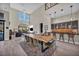 Elegant dining area with long table and seating for many at 10896 Tranquil Hills Way, Las Vegas, NV 89135