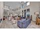 Open-concept living room with soaring ceilings and clerestory windows at 10896 Tranquil Hills Way, Las Vegas, NV 89135