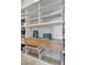 White shelving with wood trim, drawers, and wire baskets make for ample pantry storage at 10896 Tranquil Hills Way, Las Vegas, NV 89135