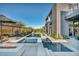 Backyard pool area with ambient lighting and a modern fire pit that extends the entertainment space at 10896 Tranquil Hills Way, Las Vegas, NV 89135