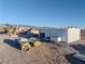 Aerial view of a large metal building next to a house and other structures at 1411 E Blosser Ranch Rd, Pahrump, NV 89060