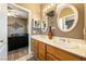 Double vanity bathroom with updated sinks and a large mirror at 1411 E Blosser Ranch Rd, Pahrump, NV 89060