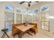 Bright breakfast nook with wood table and built-in bench seating at 1411 E Blosser Ranch Rd, Pahrump, NV 89060