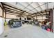 Interior view of a large garage, neatly storing multiple vehicles at 1411 E Blosser Ranch Rd, Pahrump, NV 89060