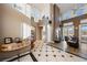 Bright living room with high ceilings, fireplace, and hardwood floors at 1411 E Blosser Ranch Rd, Pahrump, NV 89060