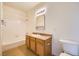 Clean bathroom with tub, shower, and wood vanity at 2051 Hussium Hills St # 207, Las Vegas, NV 89108