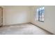 Spacious carpeted bedroom with a large window at 2051 Hussium Hills St # 207, Las Vegas, NV 89108