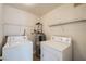 Convenient laundry room with washer, dryer, and shelving at 2051 Hussium Hills St # 207, Las Vegas, NV 89108