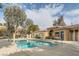 Community pool and spa area with surrounding landscaping at 2051 Hussium Hills St # 207, Las Vegas, NV 89108