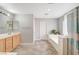 Bathroom with soaking tub, double vanity, and tile flooring at 221 Raptors View Ave, North Las Vegas, NV 89031