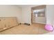 Empty bedroom with tile floors and access to the hallway at 221 Raptors View Ave, North Las Vegas, NV 89031