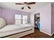 Bedroom with double bed, closet, and wood floors at 221 Raptors View Ave, North Las Vegas, NV 89031