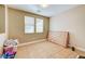 Bedroom with neutral walls, tile flooring, natural light through windows with blinds, and closet storage at 221 Raptors View Ave, Las Vegas, NV 89031