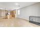 Bright bonus room with tile flooring and view of kitchen at 221 Raptors View Ave, North Las Vegas, NV 89031