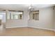 Dining room with tile floors and chandelier, featuring cutouts to other rooms at 221 Raptors View Ave, Las Vegas, NV 89031