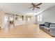 Spacious living room with tile floors and ceiling fan at 221 Raptors View Ave, North Las Vegas, NV 89031